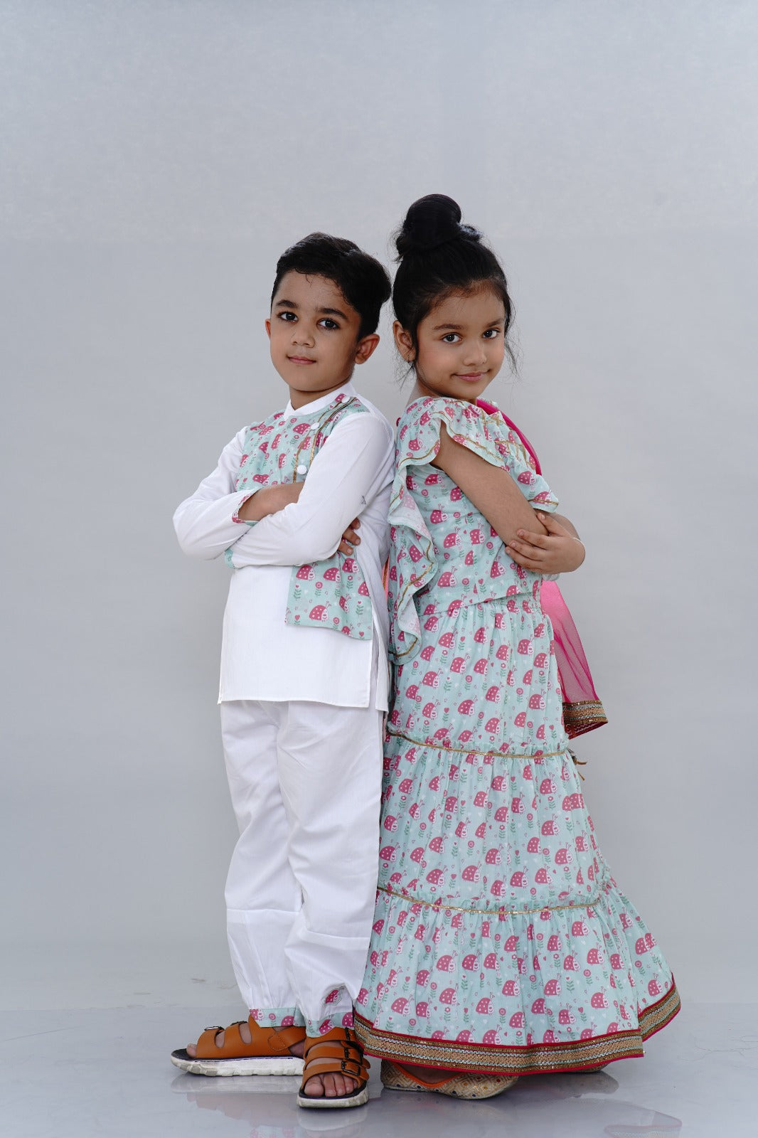 Pre Order:  Lady Bug Printed Teal Green Top And Lehenga With Contrasting Pink Dupatta